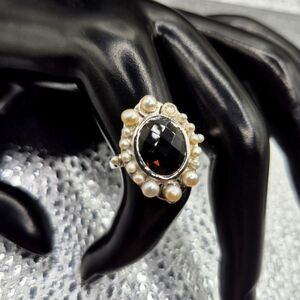 Beautiful Smokey Topaz surrounded by round freshwater Pearls.